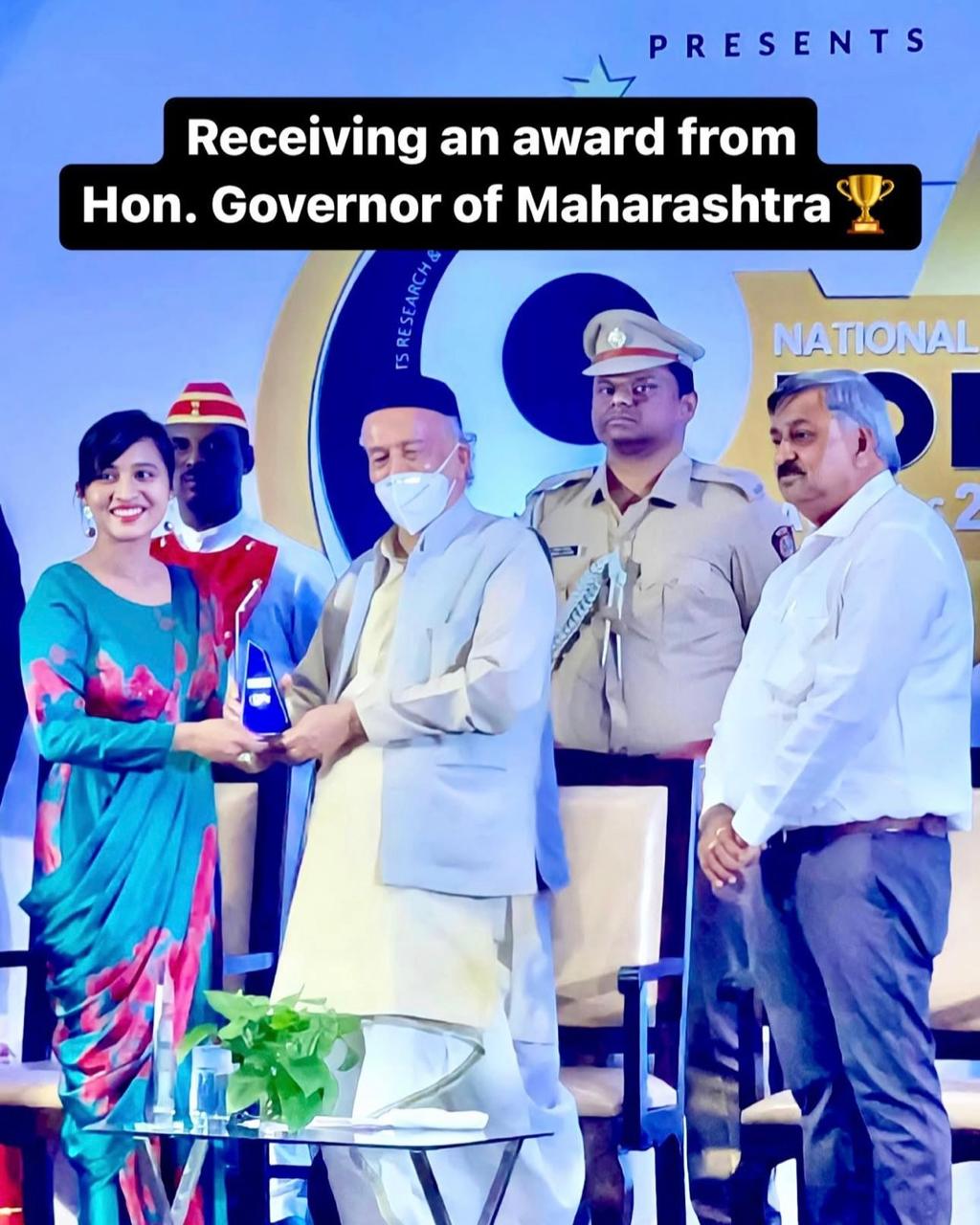 Dr. Snehal receiving award from Governor of Maharashtra